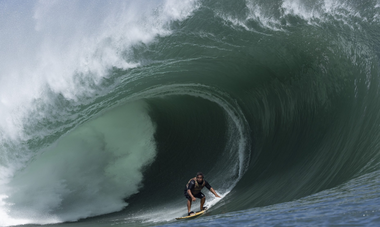 Raimana Vanbastolaer rides the wave at Teahupoʻo