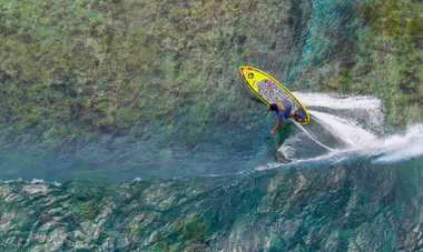 Raimana Van Bastolaer rides the wave at Teahupoʻo